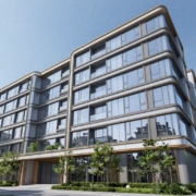 Modern London building with glass facade and metalwork.