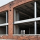 New building structure inside old brick building in Camden.